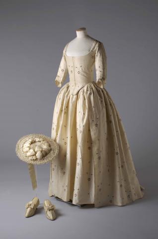 Weddings_V%26A_Silk_brocade_gown_hat_and_shoes_1780._permission_of_the_Olive_Matthews_Collection_Chertsey_Museum._Photograph_by_John_Chase.jpg